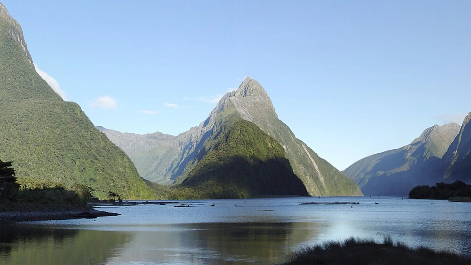 Fiordland mountains reflected in dark water