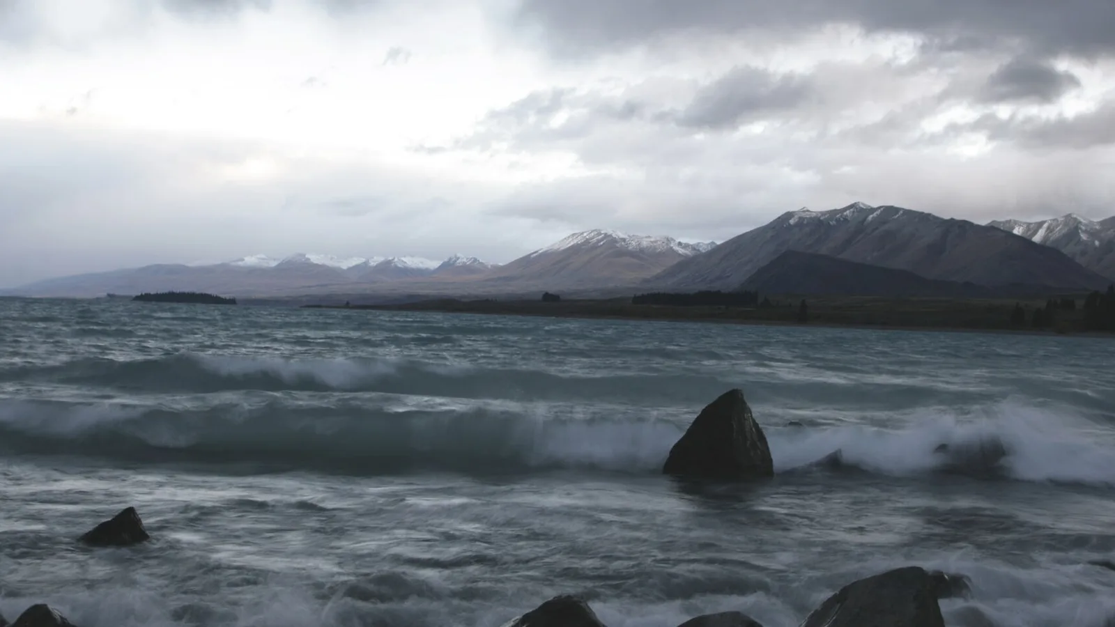Dark storm clouds over a New Zealand campsite