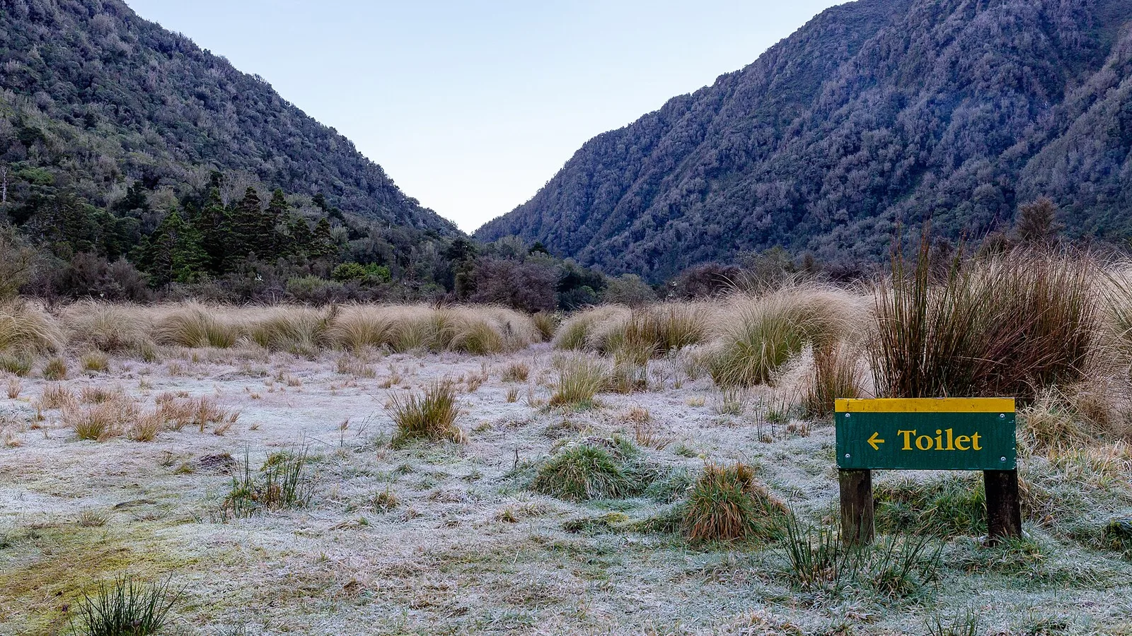 Scenic lakeside campsite beneath New Zealand mountains