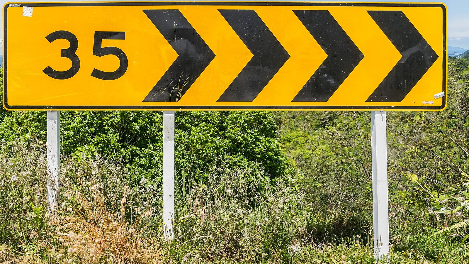 New Zealand speed limit sign on a rural road