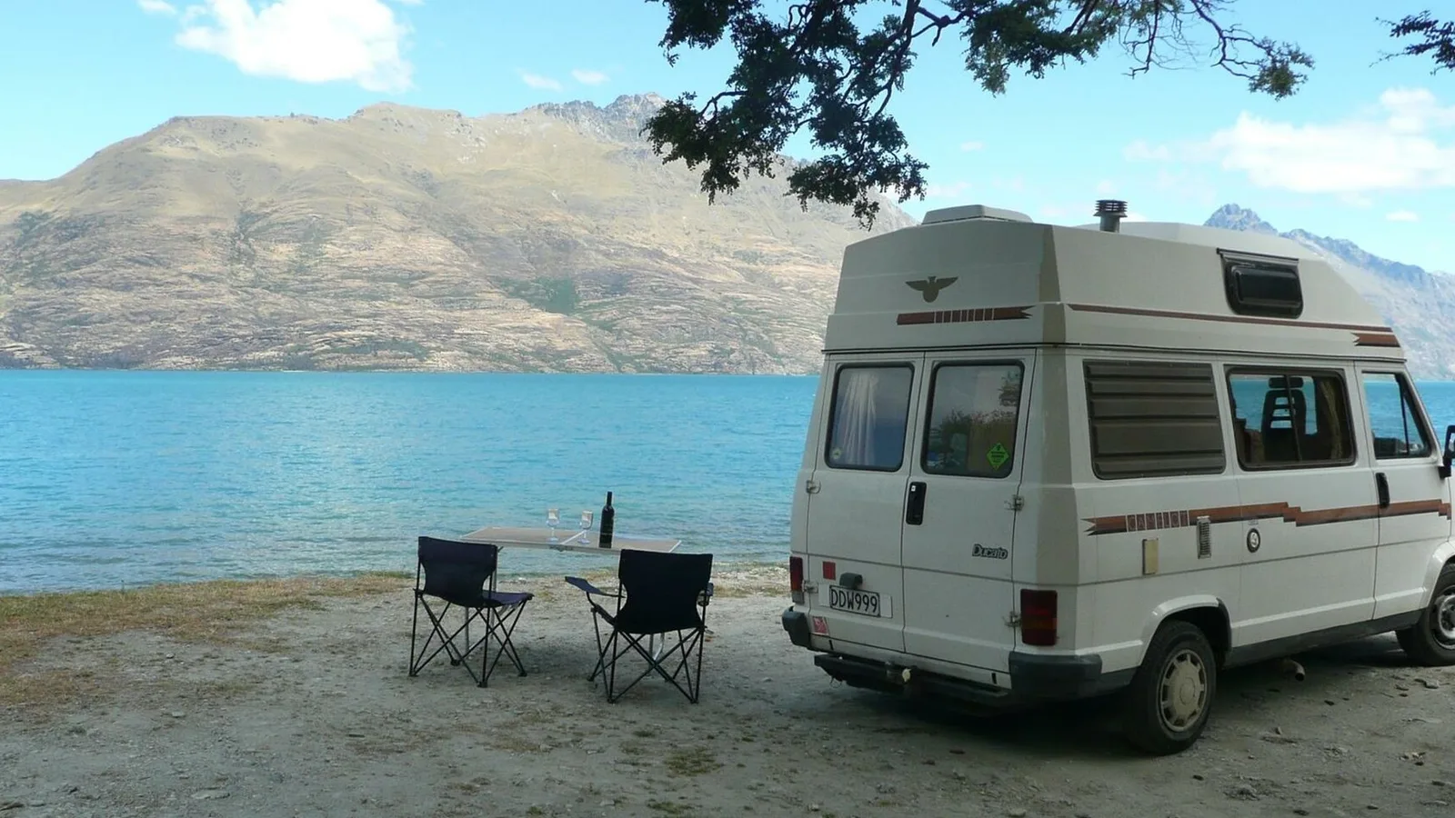 Car towing a caravan on a New Zealand highway