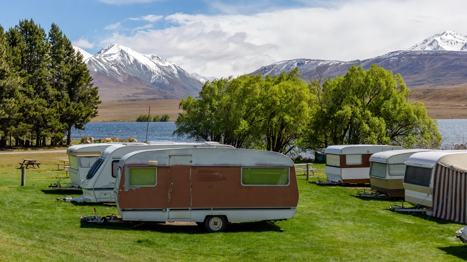 Campervan parked at a coastal New Zealand campsite