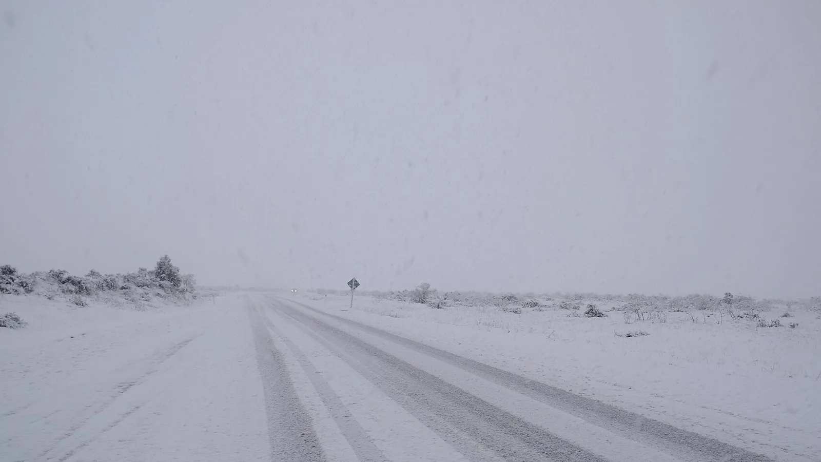 Campervan driving on a snowy New Zealand road